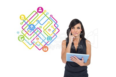 Business model is thinking and holding a tablet computer against graphics background