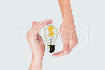 bulb on hands against white background