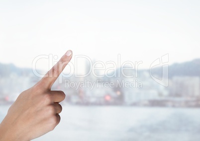Hand touching air with bright city background