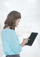 Businesswoman holding tablet at bright home