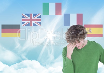 main language flags around young man. Sky background