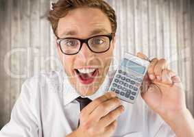 Man smiling with calculator against blurry wood panel