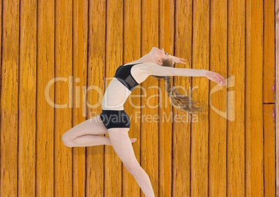 fitness woman dancing with yellow wood background