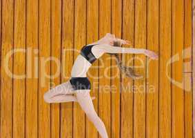 fitness woman dancing with yellow wood background