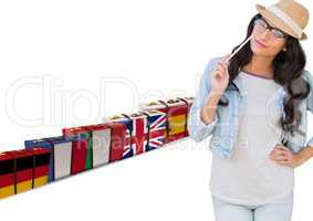 main language flag suitcases behind young woman with hat.