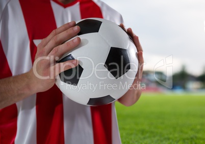 soccer player with the ball on his hands in the field