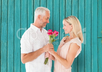 couple with light blue wood background
