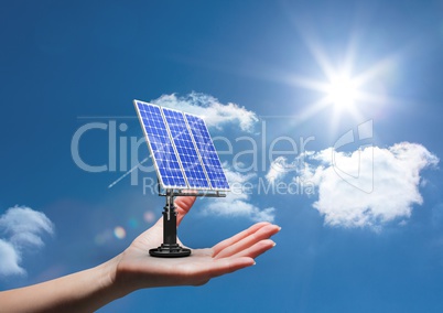 Digital composite image of solar panel on hand against sky