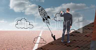 Digital composite image of businessman drawing rocket and clouds on sky