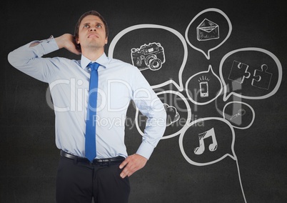 Business man scratching head against white doodle and grey wall