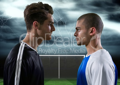 soccer players with storm behind them, looking each other