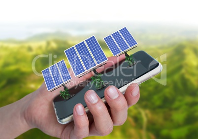 solar panels on hand with mountains behind
