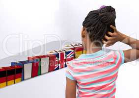 main language flag suitcases behind girl thinking