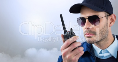 Security man outside with bright background clouds