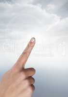 Hand touching air with sky background
