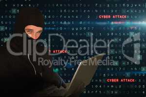 Cyber criminal wearing a hoot is hacking on laptop against matrix code rain background