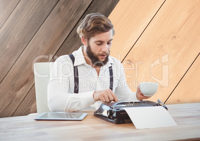 Hipster man  on typewriter with wood