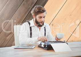 Hipster man  on typewriter with wood