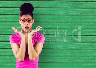 hipster with pink glasses with green wood background