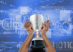 Digital composite image of hands holding trophy against binary codes