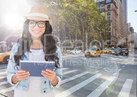 Trendy woman with tablet against sunny street with flares