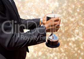 business hand with trophy, golden back
