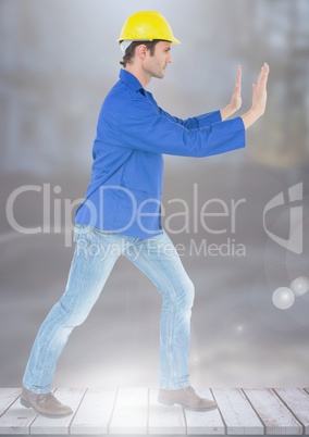 Construction Worker pushing air force in front of construction site