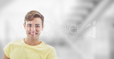 Man smiling against light background