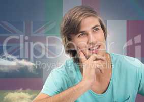 main language flags around young happy man thinking. Sky background