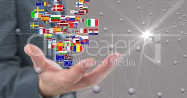 Digital composite image of business hand with flags and connecting dots
