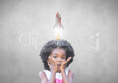 Little girl with a 3D rocket above her head