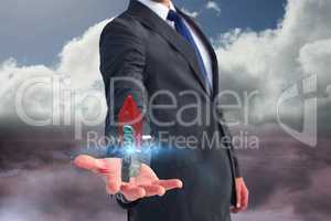 Business man holding a rocket on his hand against sky background