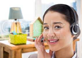 Customer service woman with headset in bright office