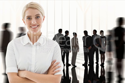 Businesswoman crosses her arms against workplace background