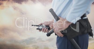 Security man outside with cloudy sky