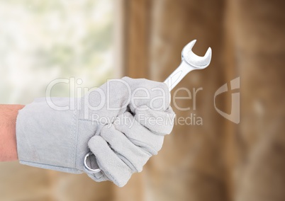 Hand with spanner on building site