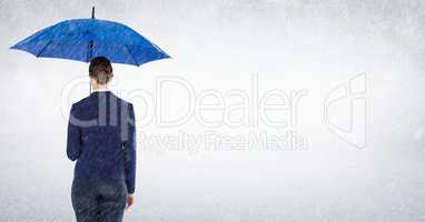 Business woman with umbrella blocking rain against white background