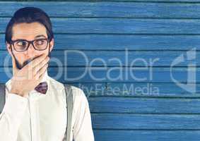 hipster with  the hand on the mouth  with blue wood background