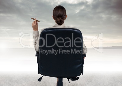 Businesswoman Back Sitting in Chair with  cigar and ocean view