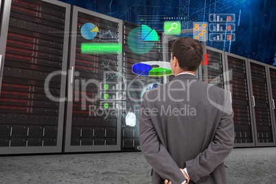 Businessman watching graphics in data center