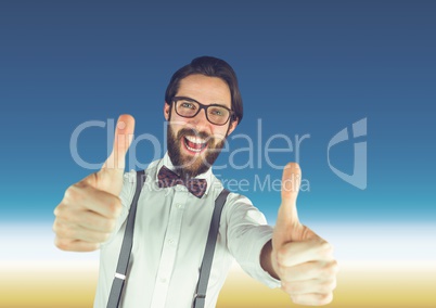 Hispter man with glasses thumbs up in front of blue background