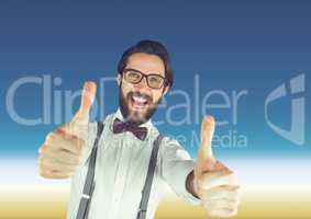 Hispter man with glasses thumbs up in front of blue background