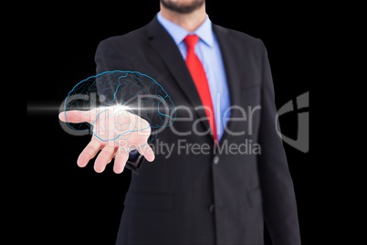 Brain on hand's businessman against black background