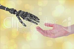 human hand touching robot hand against white background