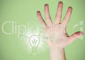 Hand next to lightbulb doodles and flare against green background