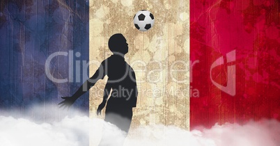 Shadow of a footballer playing in front of french flag