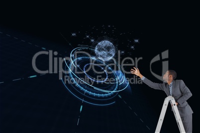 Businessman on a ladder is trying to touch a planet against black background