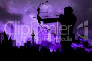 Shadow of archery player in front of purple sky background