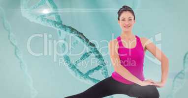 Digital composite image of sports woman doing yoga against chain of dna