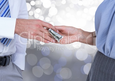 Hands exchanging money business with sparkling light bokeh background